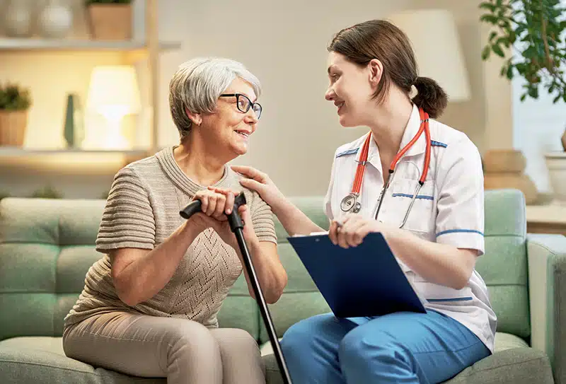 Patient receiving at home wound care from nurse practitioner